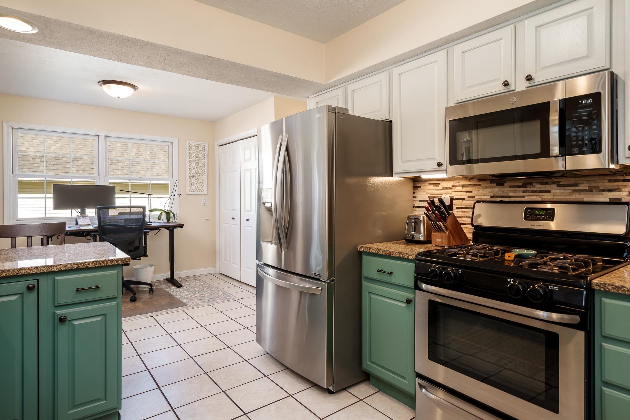 651 Genoa Street Cherry Valley, IL 61016 - Photo 64 of 70 a kitchen with cabinets and steel stainless steel appliances