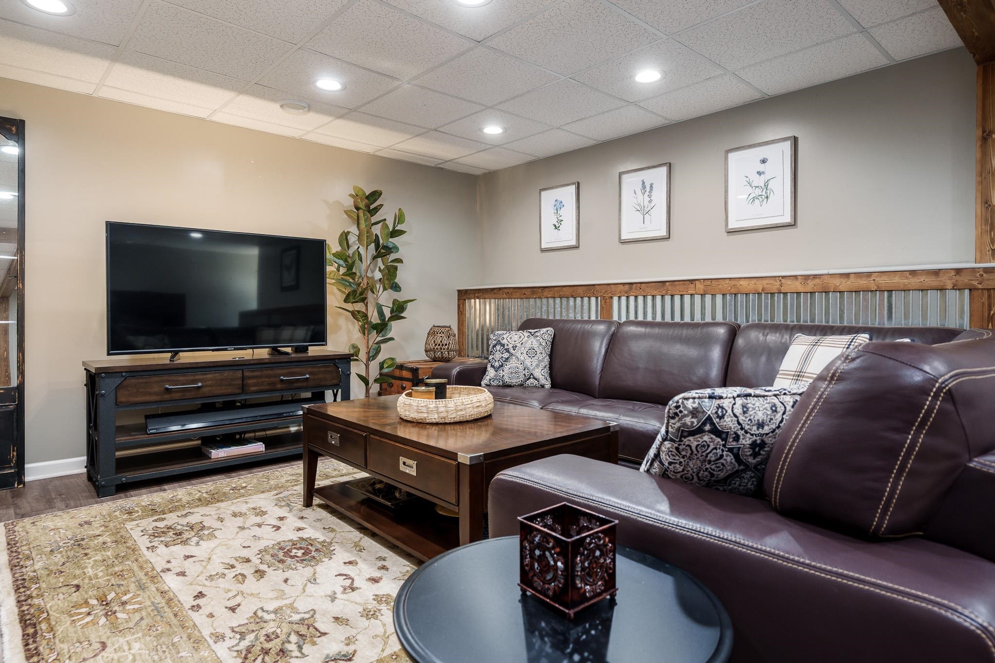 651 Genoa Street Cherry Valley, IL 61016 - Photo 66 of 70 a living room with furniture and a flat screen tv