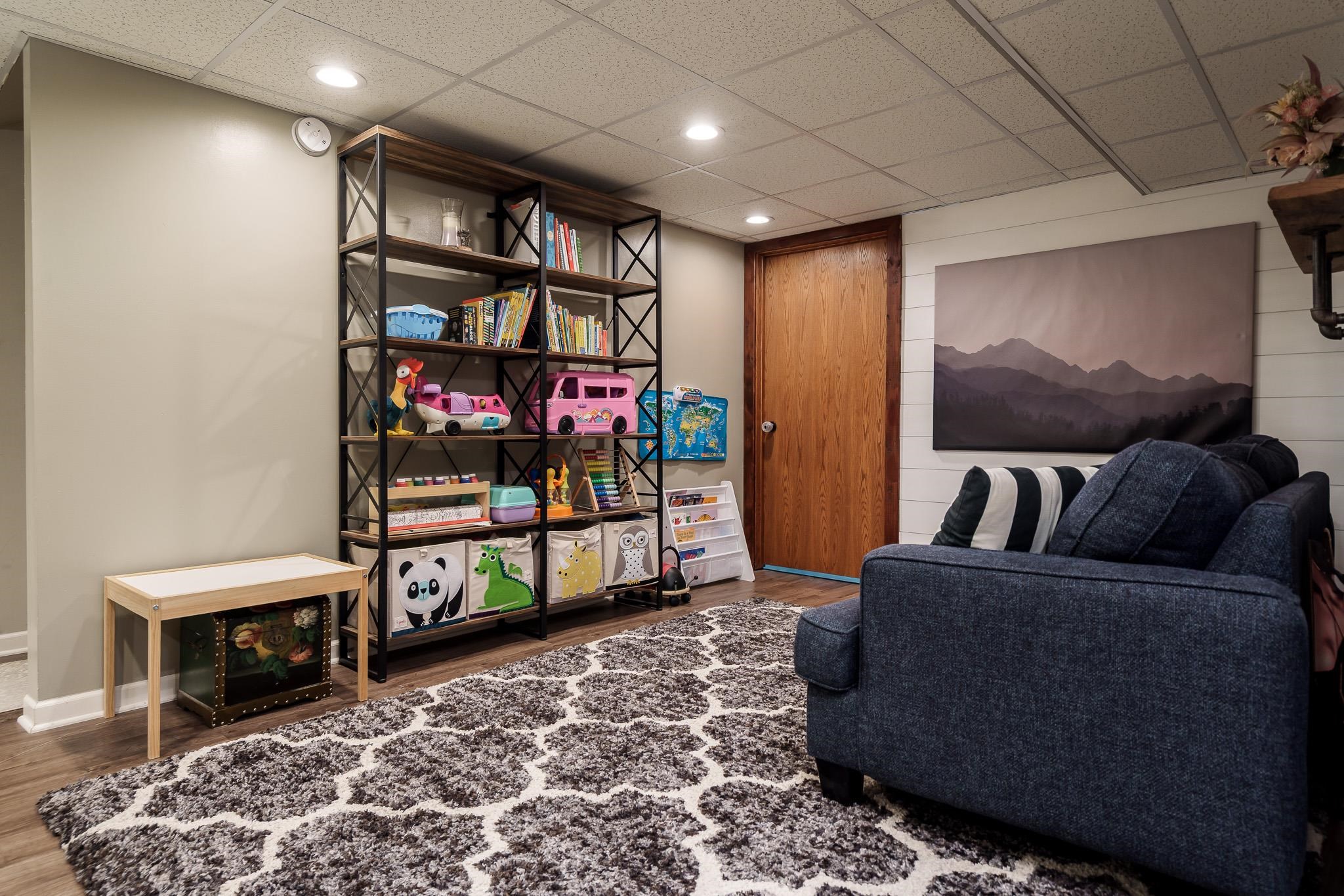 651 Genoa Street Cherry Valley, IL 61016 - Photo 66 of 70 a living room with furniture a rug and white walls