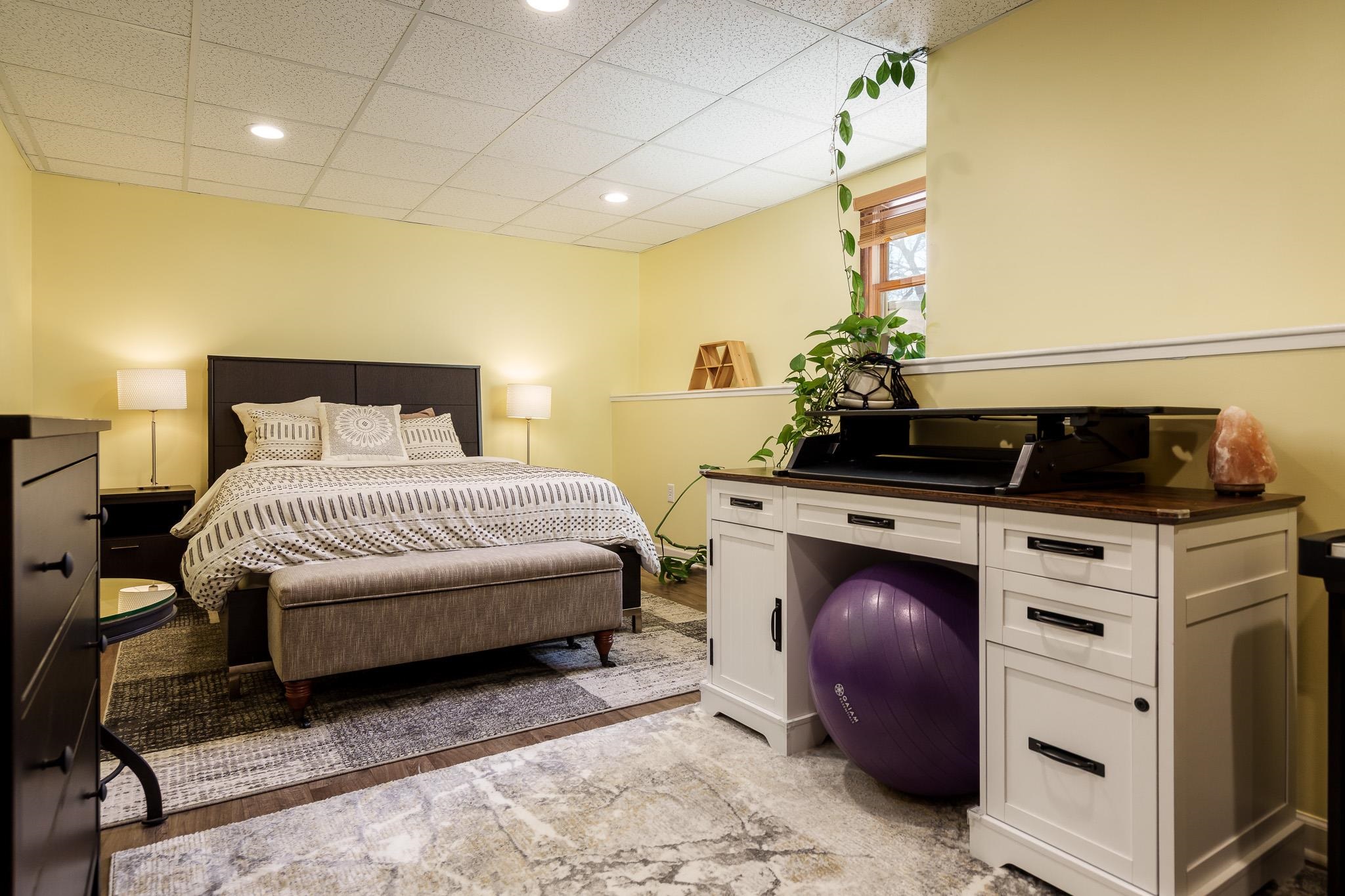 651 Genoa Street Cherry Valley, IL 61016 - Photo 68 of 70 a bedroom with a bed and a potted plant