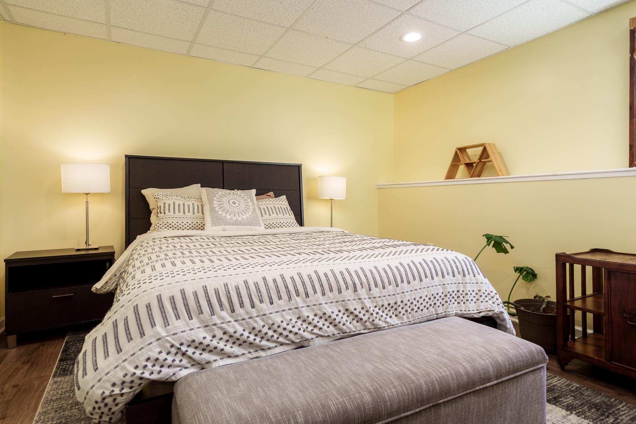 651 Genoa Street Cherry Valley, IL 61016 - Photo 69 of 70 a bedroom with a bed and a night stand