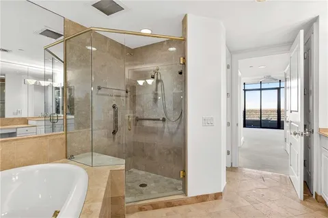 a bathroom with a bathtub and a shower