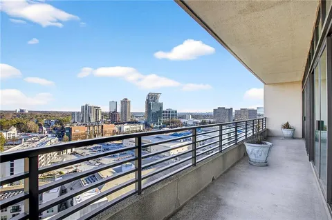 a view of a city from a balcony with city view
