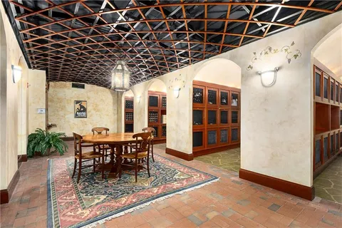 a view of a porch with a table and chairs