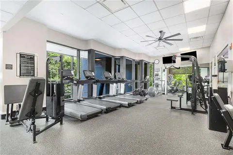 a view of a livingroom with gym equipment