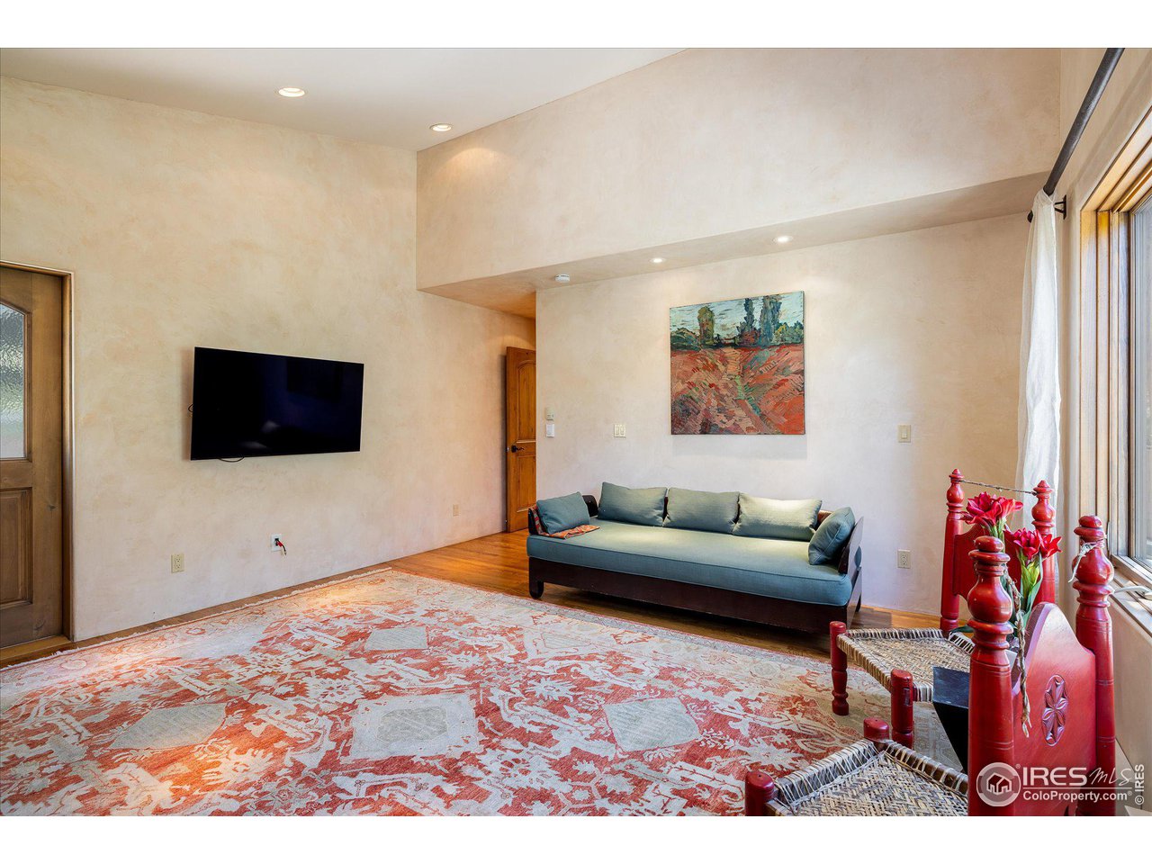 156 Betasso Road Boulder, CO 80302 - Photo 12 of 38 a living room with furniture and a flat screen tv