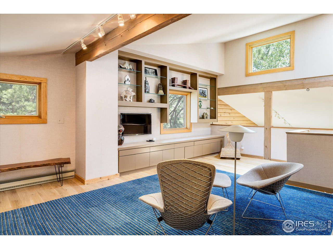 156 Betasso Road Boulder, CO 80302 - Photo 18 of 38 a living room with furniture a fireplace and a table