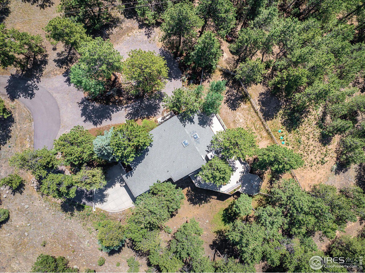 156 Betasso Road Boulder, CO 80302 - Photo 30 of 38 an aerial view of a yard with plants and large trees