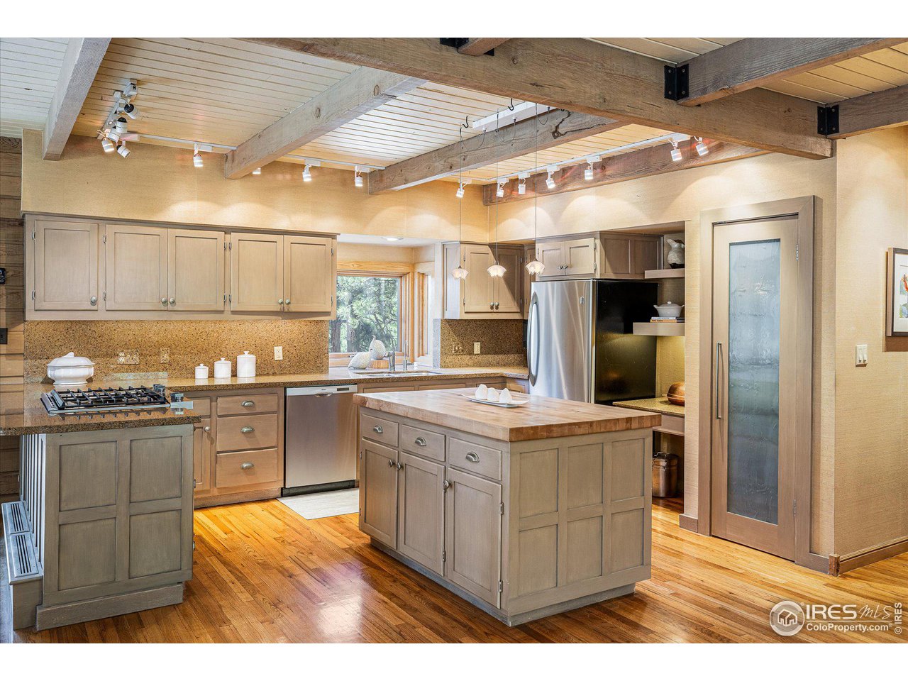 156 Betasso Road Boulder, CO 80302 - Photo 6 of 38 a kitchen with stainless steel appliances granite countertop a stove a sink and a refrigerator
