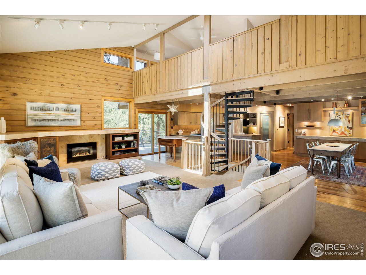 156 Betasso Road Boulder, CO 80302 - Photo 8 of 38 a living room with furniture a fireplace and a kitchen view