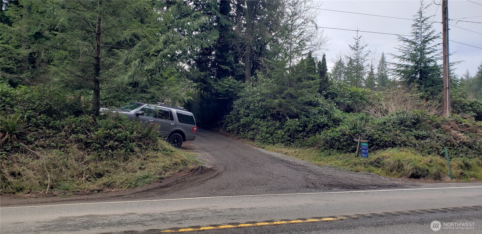 104 Northeast State Highway 104 Poulsbo, WA 98370 - Photo 31 of 34 an aerial view of a house with a yard