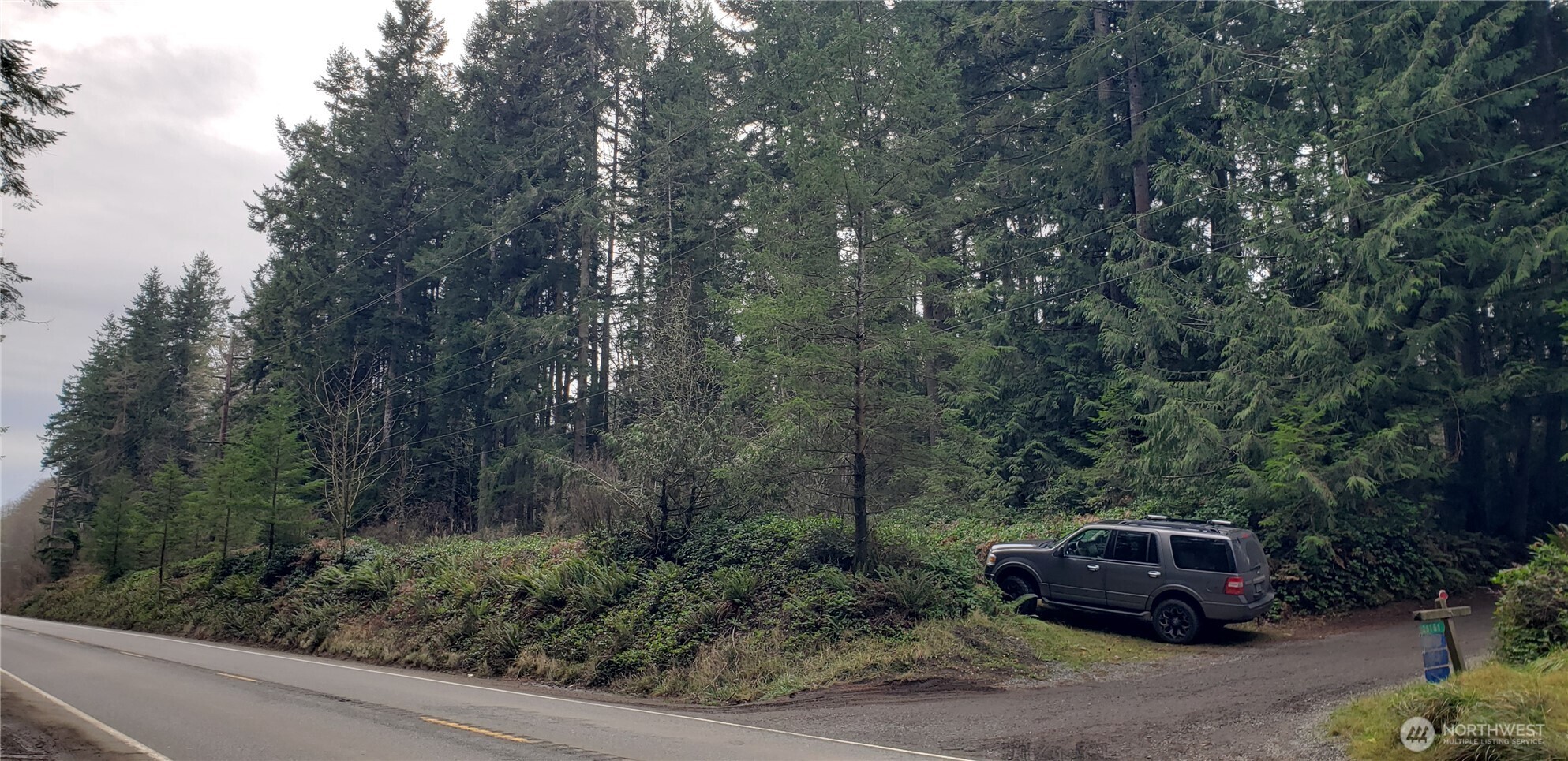 104 Northeast State Highway 104 Poulsbo, WA 98370 - Photo 32 of 34 a car parked on the side of the road
