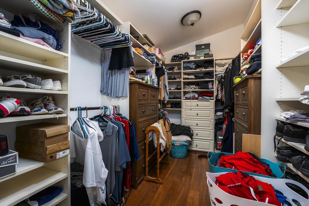 2430 Geyer Lane Alpine, CA 91901 - Photo 22 of 60 a view of walk in closet with clothes and shoes