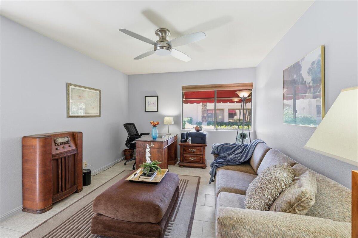 200 East Racquet Club Road, Unit 2 Palm Springs, CA 92262 - Photo 12 of 56 a living room with furniture and a large window