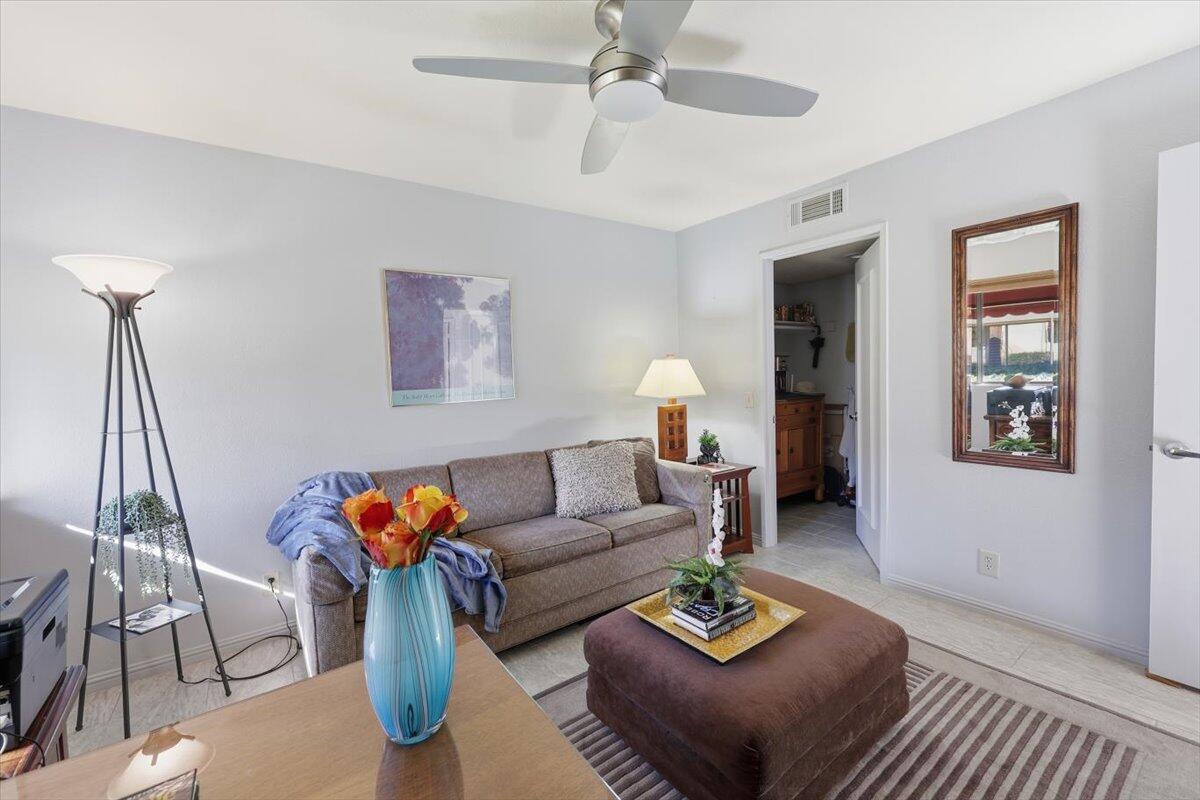 200 East Racquet Club Road, Unit 2 Palm Springs, CA 92262 - Photo 14 of 56 a living room with furniture and a rug