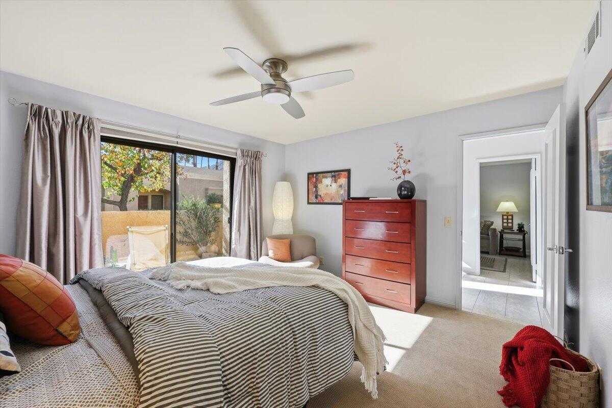 200 East Racquet Club Road, Unit 2 Palm Springs, CA 92262 - Photo 16 of 56 a bedroom with a bed and a large window