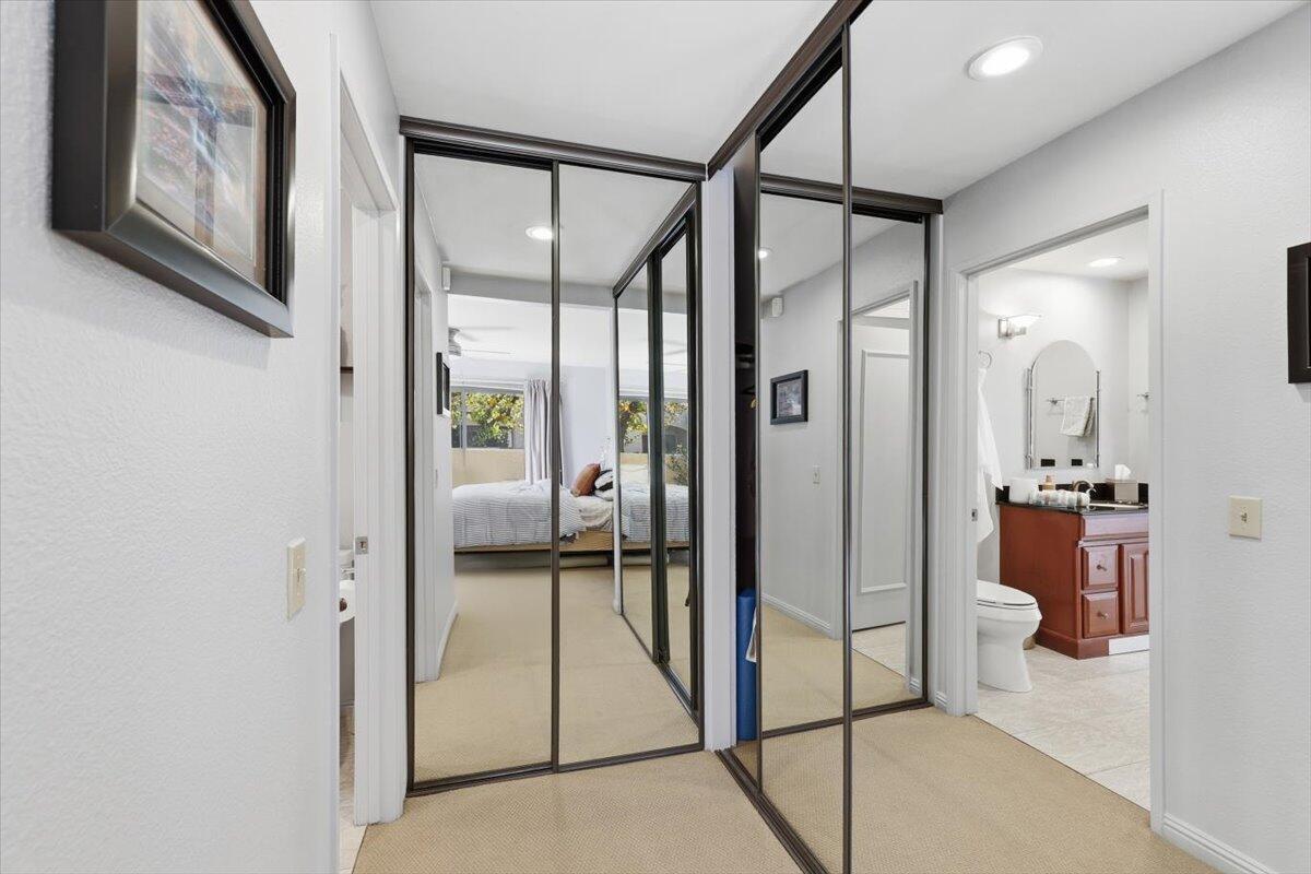 200 East Racquet Club Road, Unit 2 Palm Springs, CA 92262 - Photo 18 of 56 a bathroom with a glass shower door and a mirror