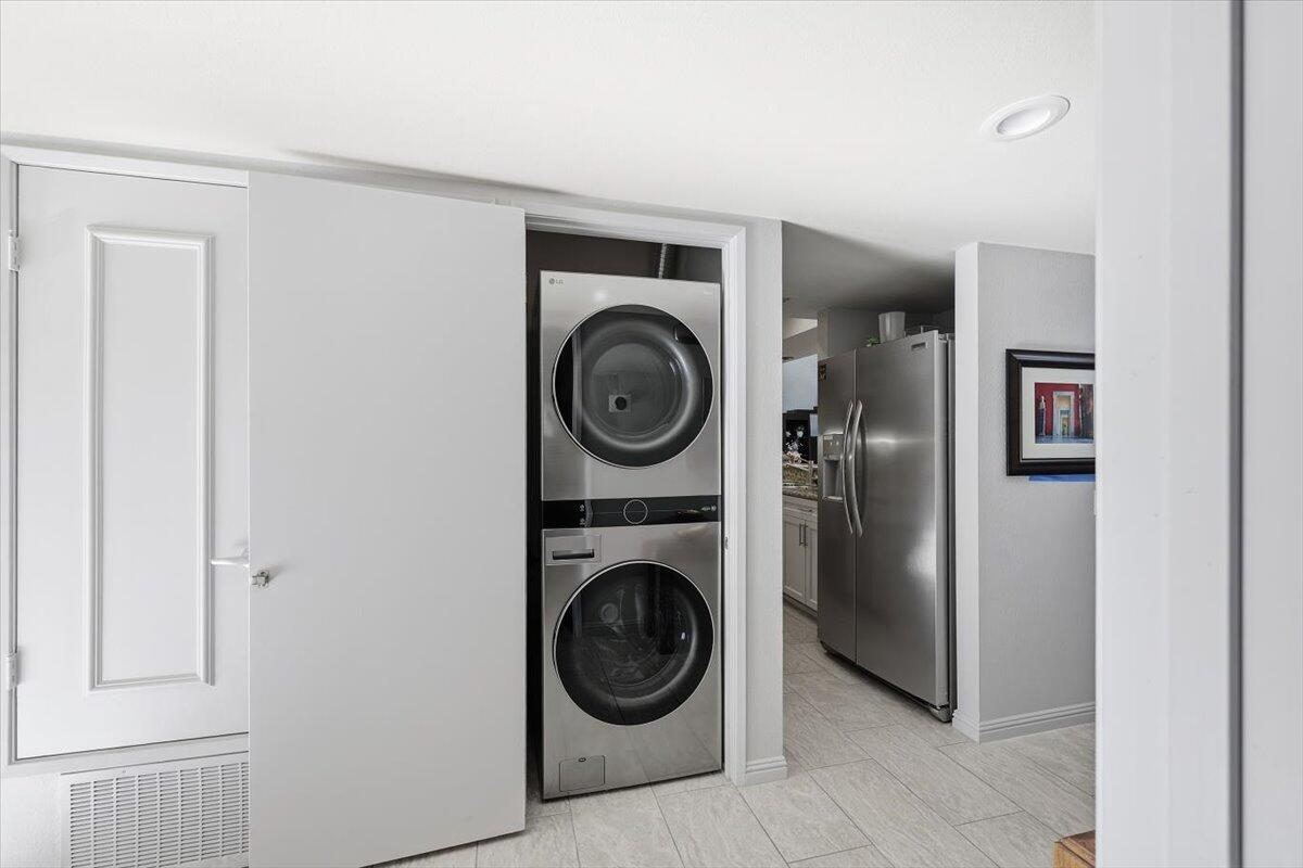 200 East Racquet Club Road, Unit 2 Palm Springs, CA 92262 - Photo 22 of 56 a view of utility room with washer and dryer