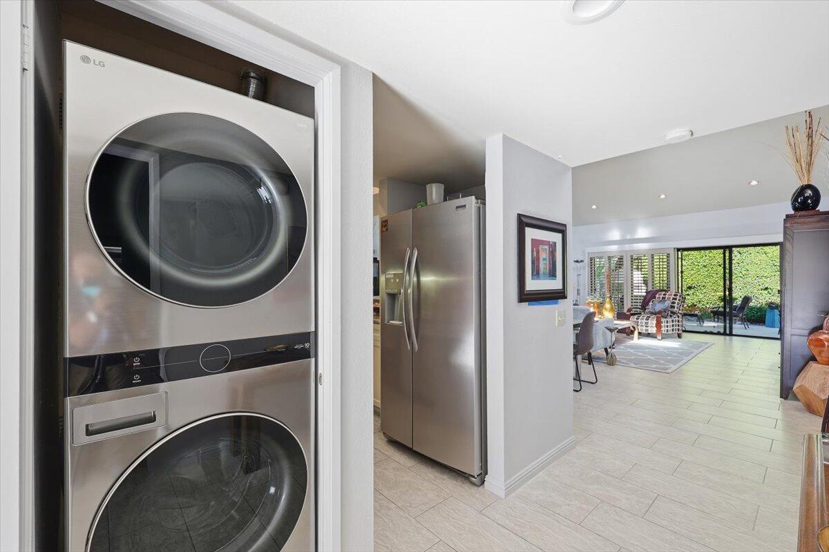 200 East Racquet Club Road, Unit 2 Palm Springs, CA 92262 - Photo 23 of 56 a view of living room washer and dryer
