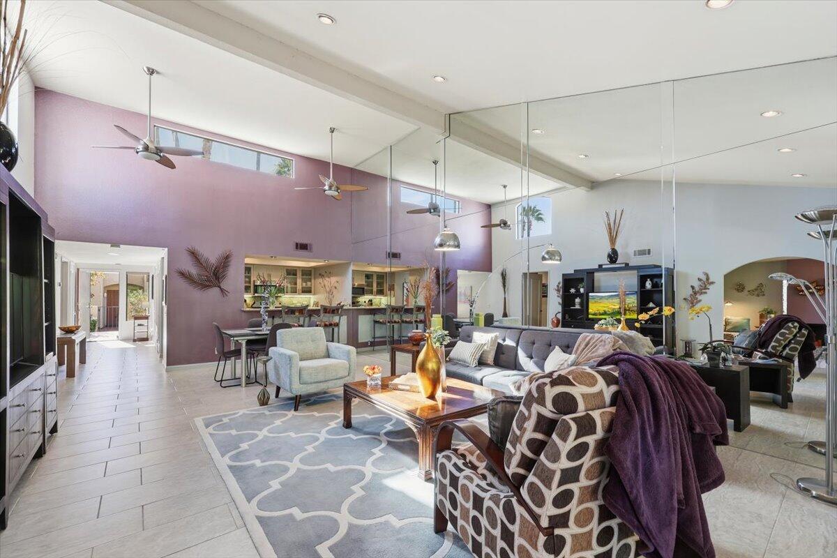 200 East Racquet Club Road, Unit 2 Palm Springs, CA 92262 - Photo 33 of 56 a living room with lots of furniture and kitchen view