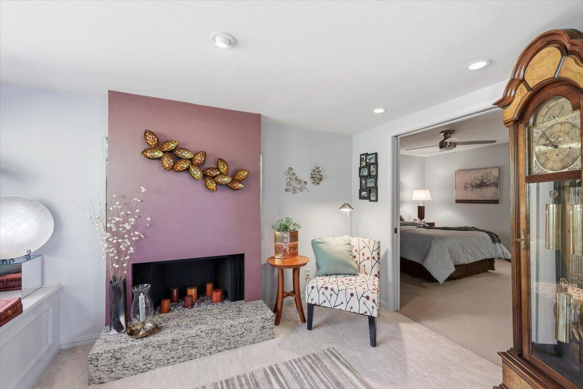 200 East Racquet Club Road, Unit 2 Palm Springs, CA 92262 - Photo 37 of 56 a bedroom with furniture and a fireplace