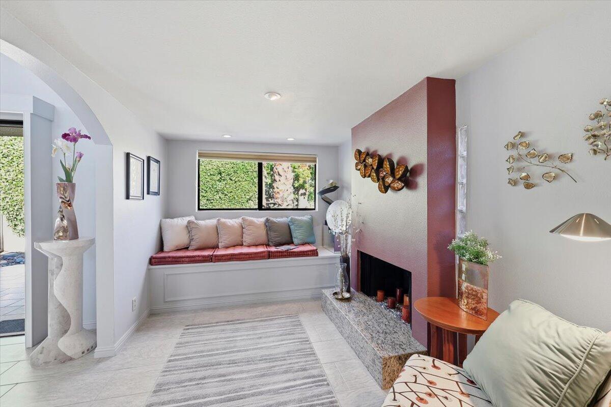 200 East Racquet Club Road, Unit 2 Palm Springs, CA 92262 - Photo 38 of 56 a living room with furniture and a fireplace