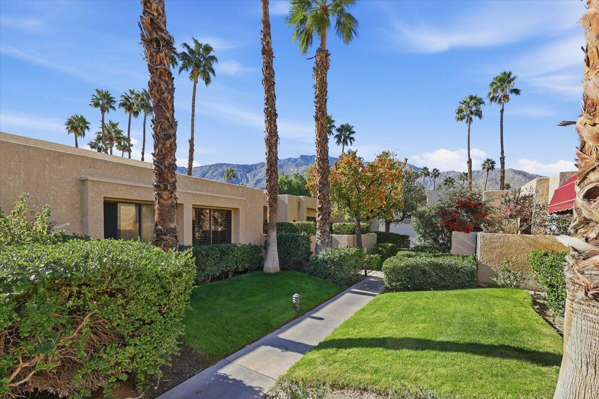 200 East Racquet Club Road, Unit 2 Palm Springs, CA 92262 - Photo 5 of 56 a view of a yard in front of a house