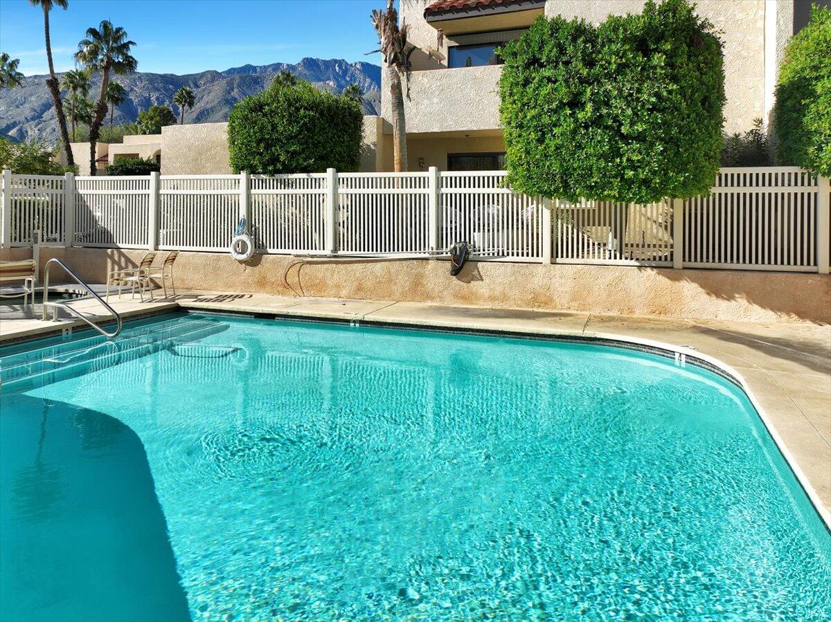 200 East Racquet Club Road, Unit 2 Palm Springs, CA 92262 - Photo 54 of 56 a view of a swimming pool with a patio