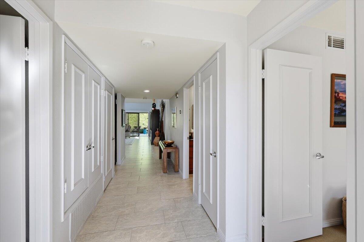 200 East Racquet Club Road, Unit 2 Palm Springs, CA 92262 - Photo 10 of 56 a view of a hallway with interior of the house