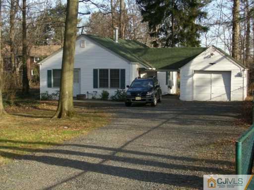 1 Devon Road Colonia, NJ 07067 - Photo 3 of 8 a car parked in front of house