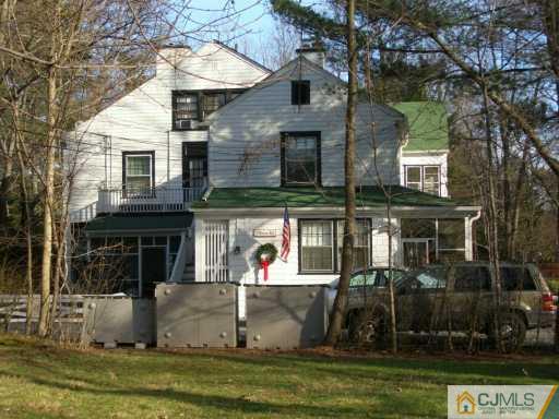 1 Devon Road Colonia, NJ 07067 - Photo 7 of 8 front view of house with a yard
