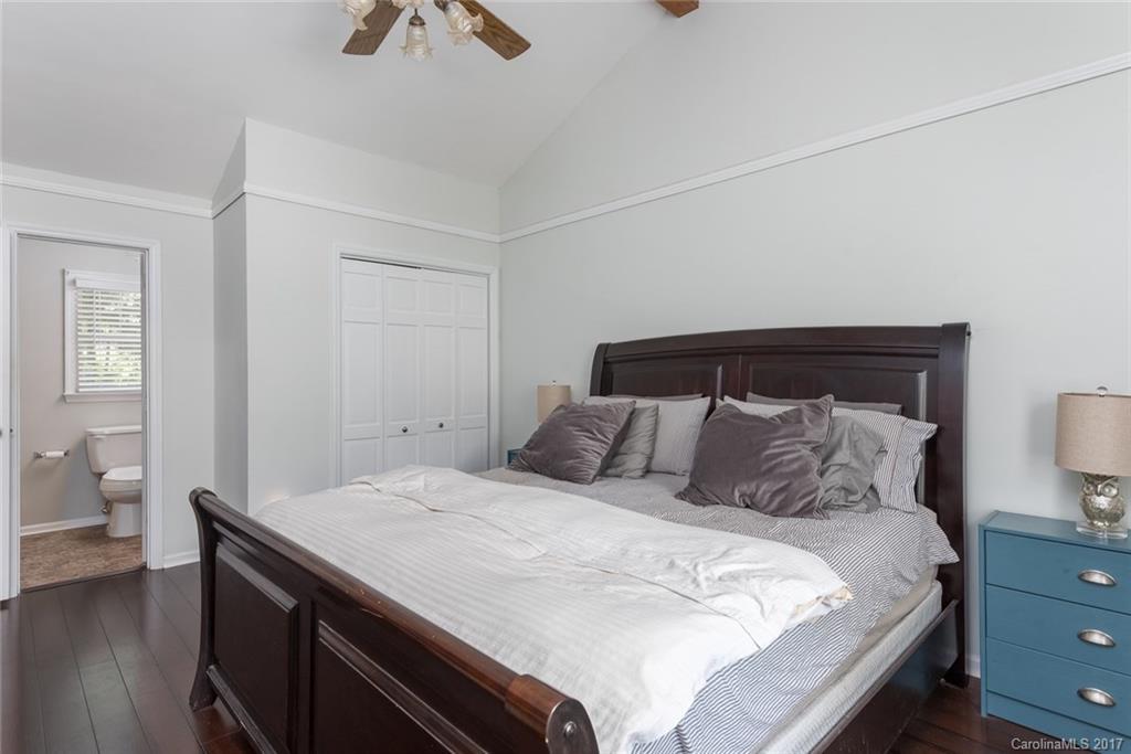 1205 Driftway Point Road Matthews, NC 28105 - Photo 14 of 24 a bedroom with a bed and wooden floor