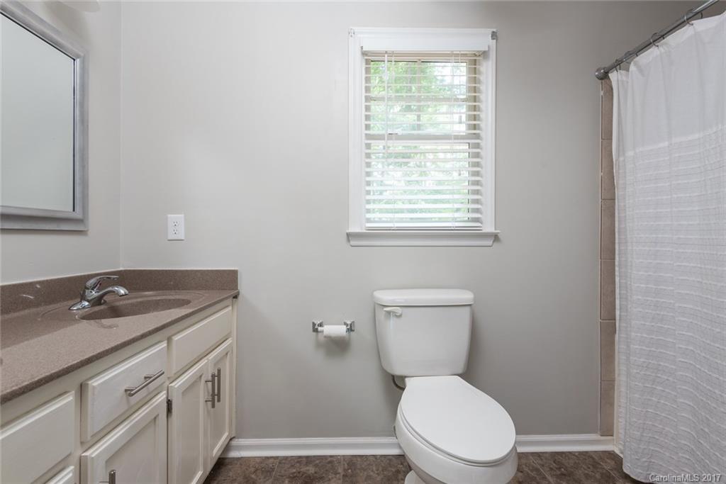 1205 Driftway Point Road Matthews, NC 28105 - Photo 15 of 24 a white toilet sitting next to a window