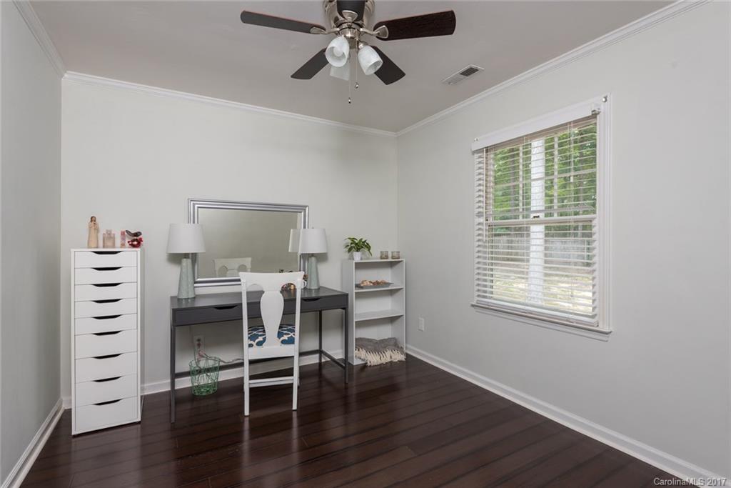 1205 Driftway Point Road Matthews, NC 28105 - Photo 16 of 24 a workspace with wooden floor a chandelier fan and windows
