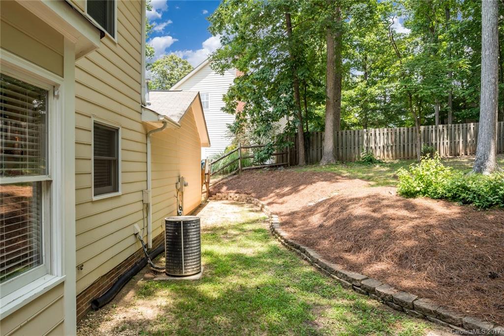 1205 Driftway Point Road Matthews, NC 28105 - Photo 20 of 24 a backyard of a house with seating space