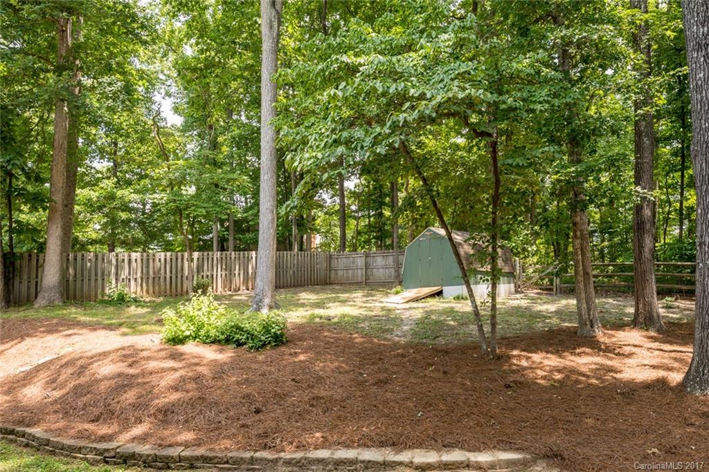 1205 Driftway Point Road Matthews, NC 28105 - Photo 22 of 24 a backyard of a house with lots of green space