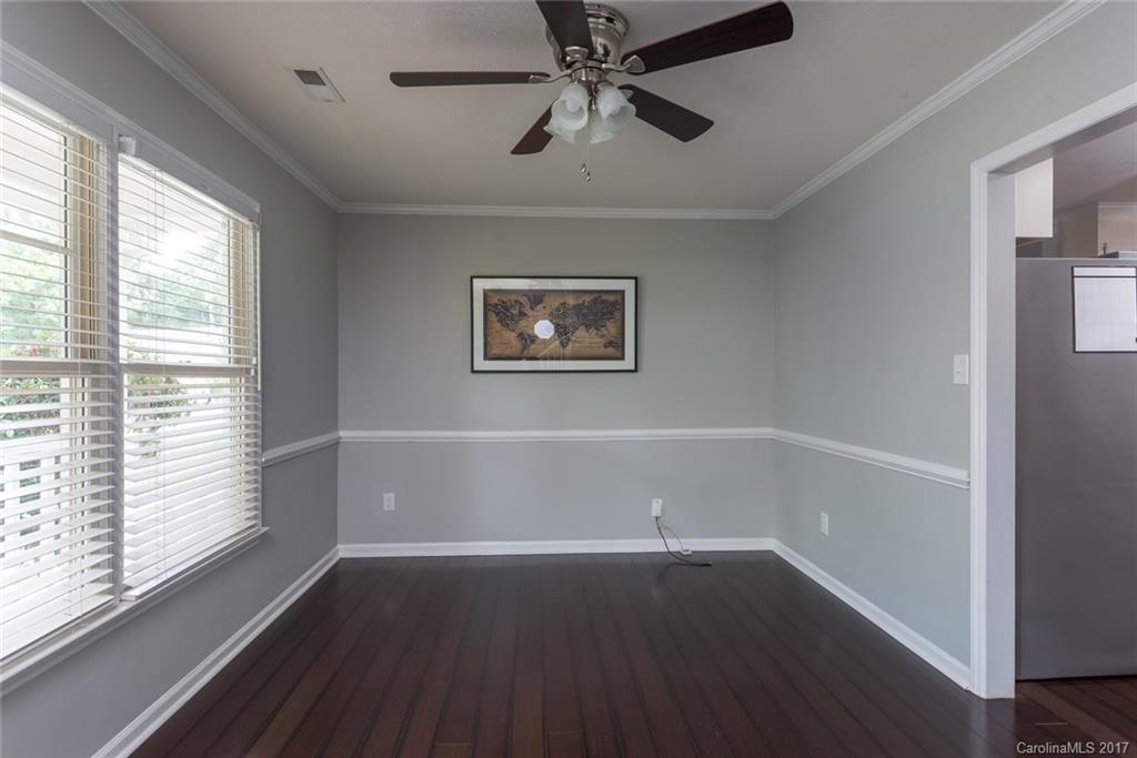 1205 Driftway Point Road Matthews, NC 28105 - Photo 4 of 24 a view of an empty room with wooden floor and a window