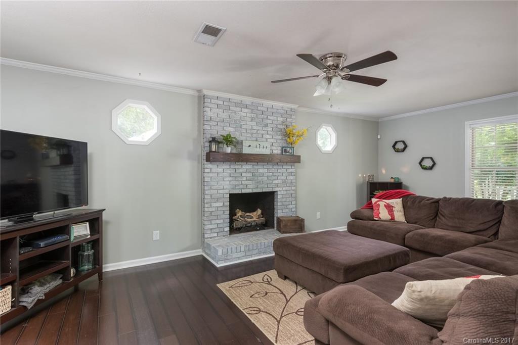 1205 Driftway Point Road Matthews, NC 28105 - Photo 5 of 24 a living room with furniture and a fireplace