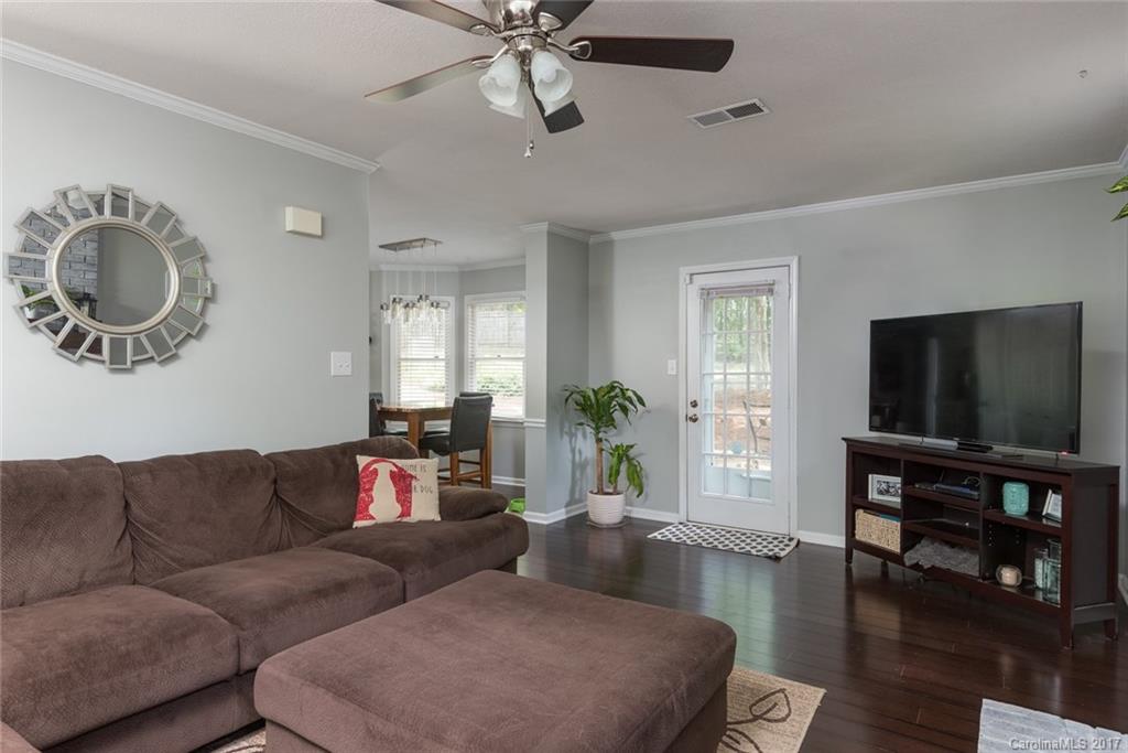 1205 Driftway Point Road Matthews, NC 28105 - Photo 6 of 24 a living room with furniture and a flat screen tv