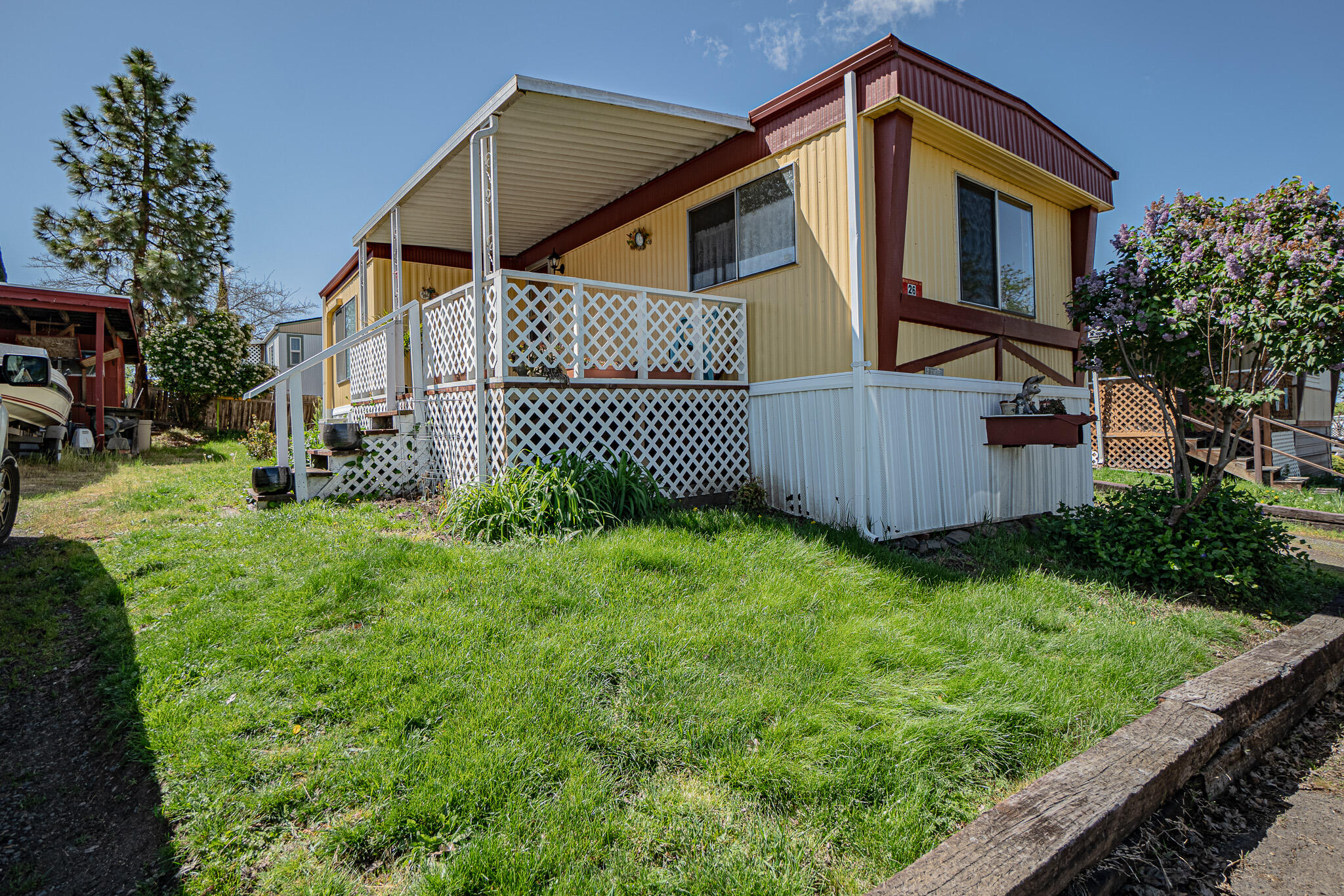 421 Stevens Road, Unit 26 Eagle Point, OR 97524 - Photo 1 of 23 a view of a house with wooden fence