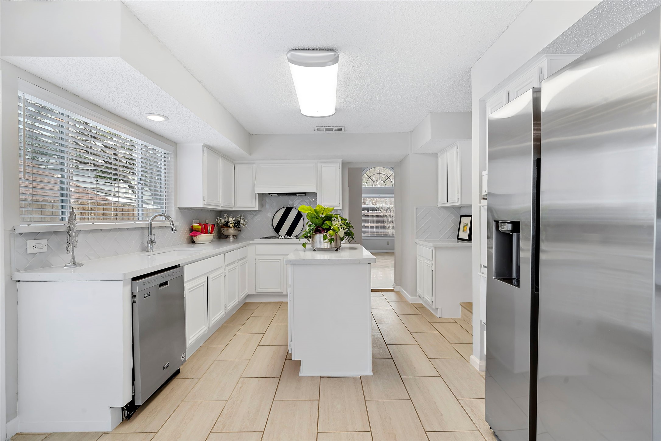 12800 Briar Forest Drive, Unit 48 Houston, TX 77077 - Photo 11 of 36 a kitchen with a refrigerator and a sink