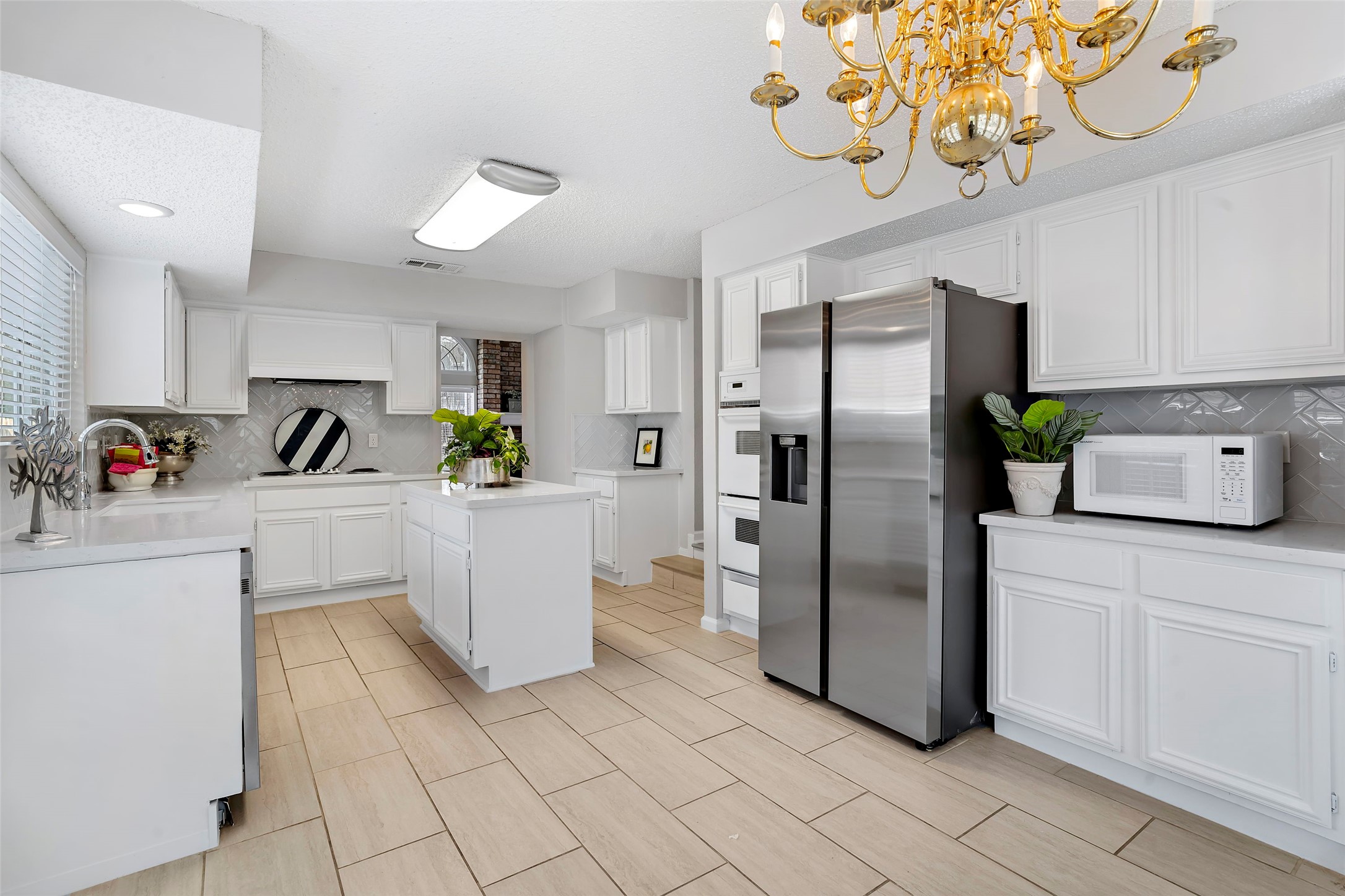 12800 Briar Forest Drive, Unit 48 Houston, TX 77077 - Photo 12 of 36 a kitchen with a refrigerator and a sink