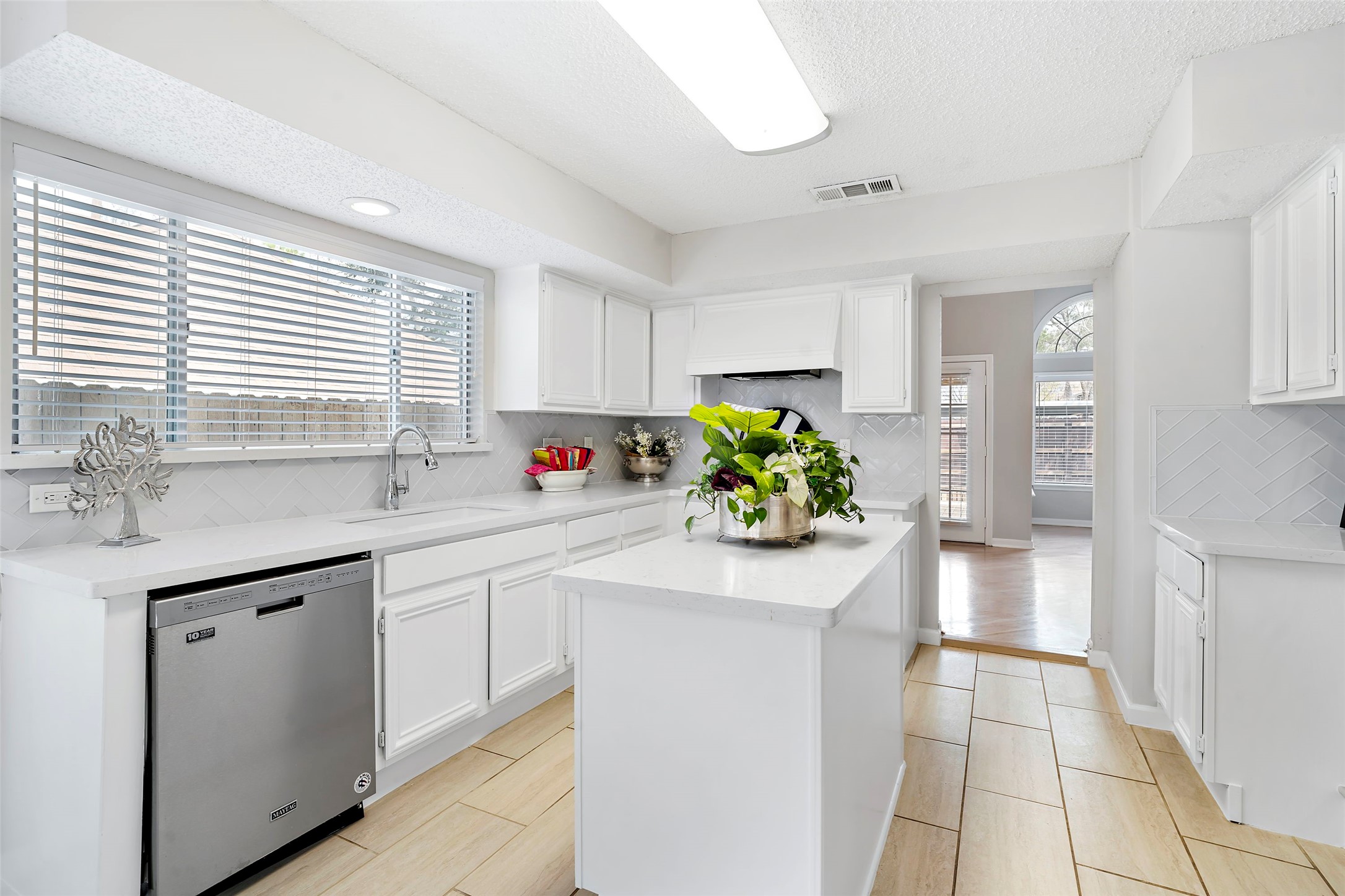 12800 Briar Forest Drive, Unit 48 Houston, TX 77077 - Photo 18 of 36 a kitchen with a sink and cabinets