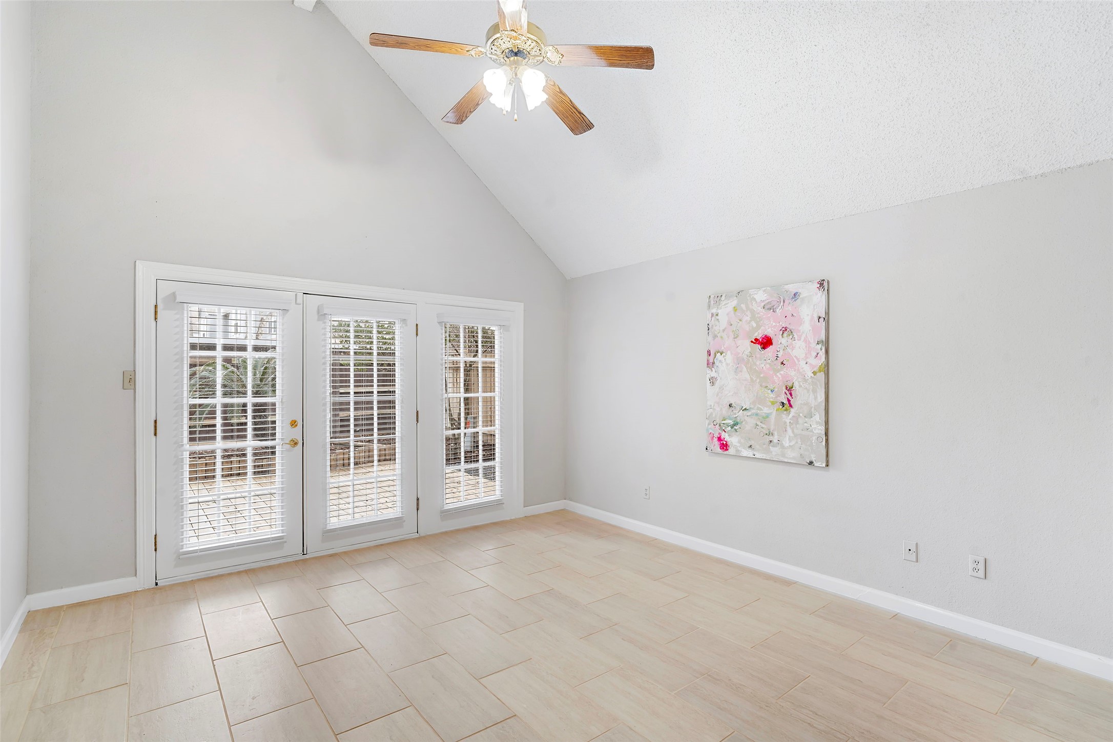 12800 Briar Forest Drive, Unit 48 Houston, TX 77077 - Photo 21 of 36 an empty room with windows and fan