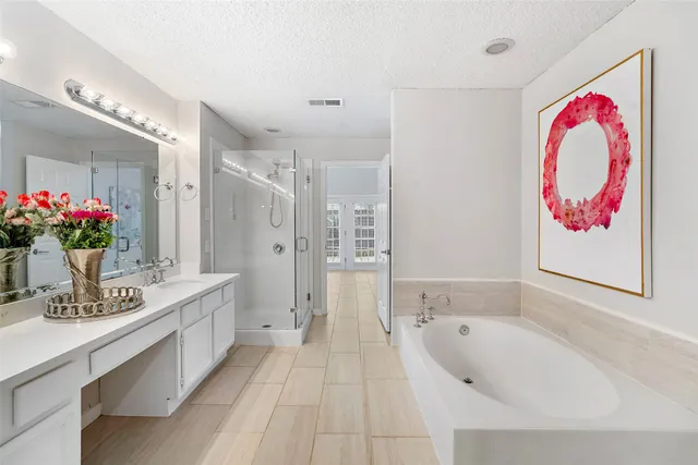 a bathroom with a sink double vanity and a mirror