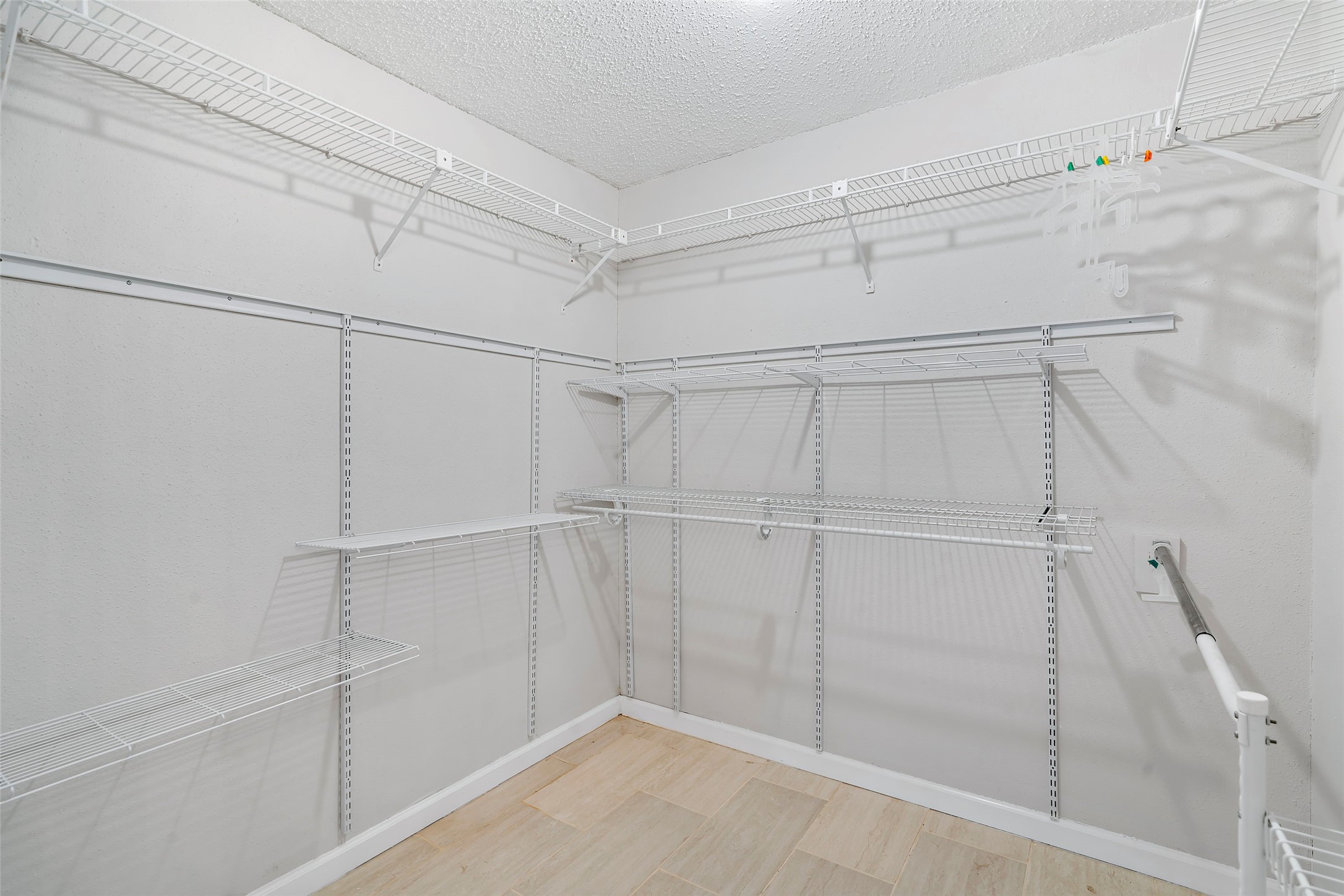 12800 Briar Forest Drive, Unit 48 Houston, TX 77077 - Photo 24 of 36 a view of a room with racks on the wall