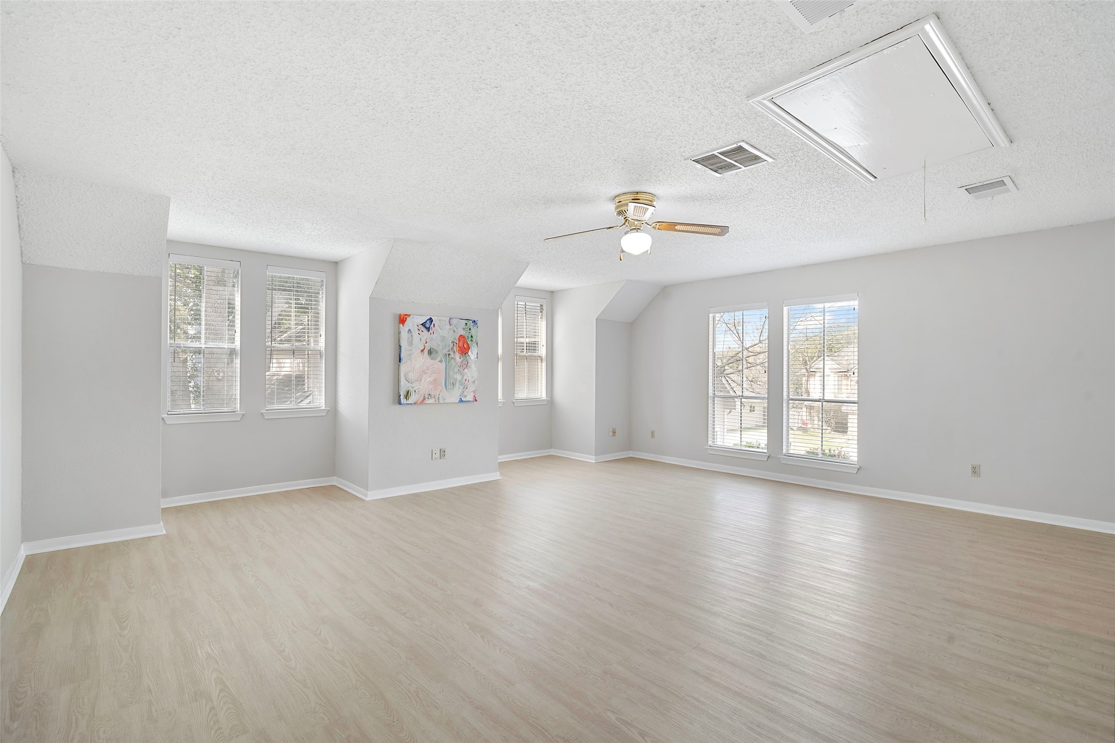 12800 Briar Forest Drive, Unit 48 Houston, TX 77077 - Photo 27 of 36 a view of an empty room with wooden floor and a window