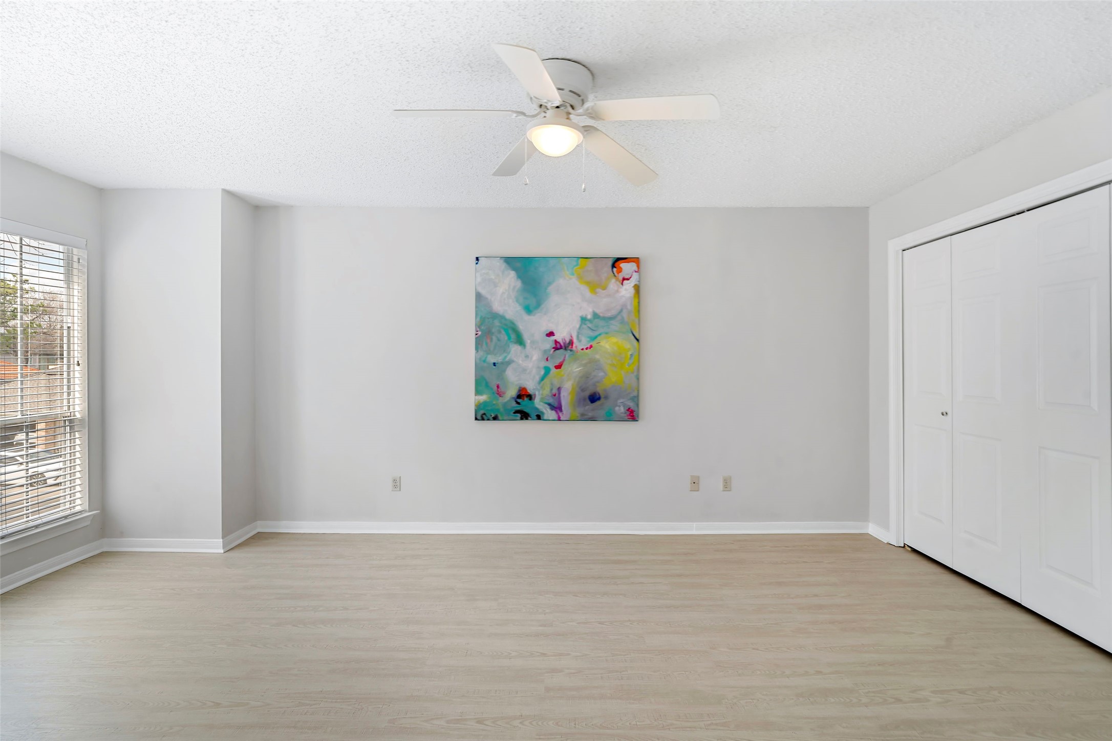 12800 Briar Forest Drive, Unit 48 Houston, TX 77077 - Photo 29 of 36 an empty room with a ceiling fan and window