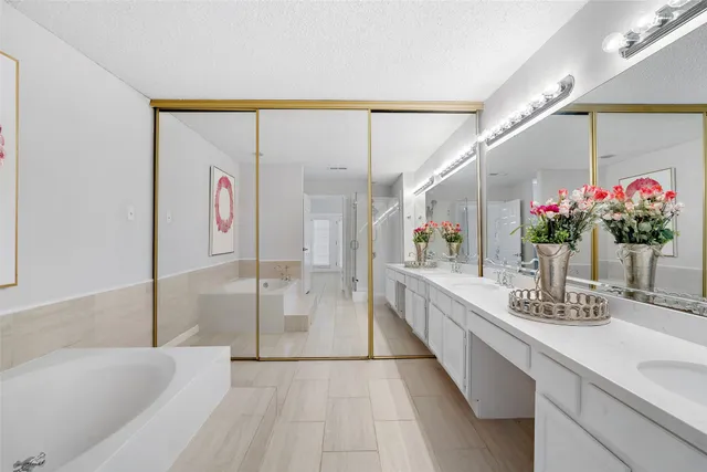 a bathroom with a double vanity sink mirror and double