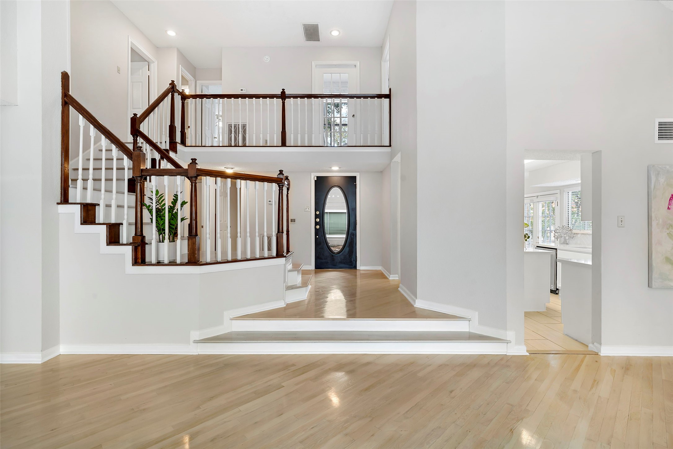 12800 Briar Forest Drive, Unit 48 Houston, TX 77077 - Photo 3 of 36 a view of a hallway with wooden floor and staircase